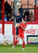 1 April 2024; Ronan Boyce of Derry City is tackled by Sean Boyd of Shelbourne during the SSE Airtricity Men's Premier Division match between Shelbourne and Derry City at Tolka Park in Dublin. Photo by Stephen McCarthy/Sportsfile