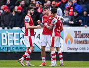1 April 2024; Mason Melia of St Patrick's Athletic celebrates with teammates Luke Turner and Ruairi Keating after scoring his side's third goal  during the SSE Airtricity Men's Premier Division match between St Patrick's Athletic and Sligo Rovers at Richmond Park in Dublin. Photo by Harry Murphy/Sportsfile