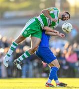 1 April 2024; Roberto Lopes of Shamrock Rovers in action against Pádraig Amond of Waterford during the SSE Airtricity Men's Premier Division match between Waterford and Shamrock Rovers at the Regional Sports Centre in Waterford. Photo by Tyler Miller/Sportsfile