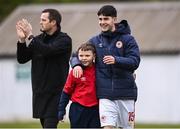 1 April 2024; Arron Pettifer of St Patrick's Athletic with St Patrick's Athletic supporter Adam McGill, son of the St Patrick's Athletic kitman David McGill, after their side's victory in the SSE Airtricity Men's Premier Division match between St Patrick's Athletic and Sligo Rovers at Richmond Park in Dublin. Photo by Harry Murphy/Sportsfile