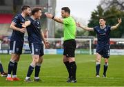 1 April 2024; Derry City players, from left, Will Patching, Cameron McJannet and Ciarán Coll appeal to referee Eoghan O'Shea during the SSE Airtricity Men's Premier Division match between Shelbourne and Derry City at Tolka Park in Dublin. Photo by Stephen McCarthy/Sportsfile