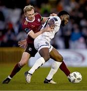 1 April 2024; Conor McCormack of Galway United in action against James Akintunde of Bohemians during the SSE Airtricity Men's Premier Division match between Galway United and Bohemians at Eamonn Deacy Park in Galway. Photo by Piaras Ó Mídheach/Sportsfile
