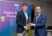 1 April 2024; Gavin Lee, University of Galway, Clarinbridge & Galway receives his 2023 Electric Ireland GAA Higher Education Rising Stars Hurling Team of the Year Award from Chair of the GAA Higher Education Committee Michael Hyland during the 2024 Electric Ireland GAA Higher Education Rising Star Awards at the Castleknock Hotel in Dublin. Photo by David Fitzgerald/Sportsfile