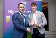 1 April 2024; Fergal O’Connor, University of Limerick, Effin & Limerick receives his 2023 Electric Ireland GAA Higher Education Rising Stars Hurling Team of the Year Award from Chair of the GAA Higher Education Committee Michael Hyland during the 2024 Electric Ireland GAA Higher Education Rising Star Awards at the Castleknock Hotel in Dublin. Photo by David Fitzgerald/Sportsfile