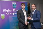1 April 2024; Eoghan Frayne, Maynooth, Summerhill & Meath receives his 2023 Electric Ireland GAA Higher Education Rising Stars Football Team of the Year Award from Chair of the GAA Higher Education Committee Michael Hyland during the 2024 Electric Ireland GAA Higher Education Rising Star Awards at the Castleknock Hotel in Dublin. Photo by David Fitzgerald/Sportsfile