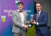 1 April 2024; Dáire Cregg, UCD, Boyle & Roscommon receives his 2023 Electric Ireland GAA Higher Education Rising Stars Football Team of the Year Award from Chair of the GAA Higher Education Committee Michael Hyland during the 2024 Electric Ireland GAA Higher Education Rising Star Awards at the Castleknock Hotel in Dublin. Photo by David Fitzgerald/Sportsfile