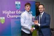 1 April 2024; Adam Hogan, MICL, Feakle & Clare, receives his 2023 Electric Ireland GAA Higher Education Rising Stars Hurler of the Year Award from Chair of the GAA Higher Education Committee Michael Hyland during the 2024 Electric Ireland GAA Higher Education Rising Star Awards at the Castleknock Hotel in Dublin. Photo by David Fitzgerald/Sportsfile