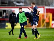 1 April 2024; Daniel Kelly of Derry City with Shelbourne ballboy Johnny Figo Murphy after the SSE Airtricity Men's Premier Division match between Shelbourne and Derry City at Tolka Park in Dublin. Photo by Stephen McCarthy/Sportsfile