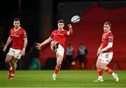 30 March 2024; Jack Crowley of Munster, centre, with teammates Shane Daly and Craig Casey during the United Rugby Championship match between Munster and Cardiff at Thomond Park in Limerick. Photo by Harry Murphy/Sportsfile
