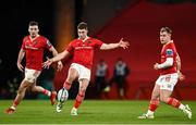 30 March 2024; Jack Crowley of Munster, centre, with teammates Shane Daly and Craig Casey during the United Rugby Championship match between Munster and Cardiff at Thomond Park in Limerick. Photo by Harry Murphy/Sportsfile