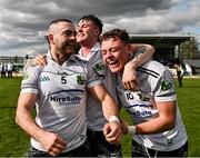31 March 2024; Warwickshire players, from left, Oisín Slattery, David Devine and Dan Lowry celebrate after their side's victory in the Allianz Hurling League Division 3B Final match between Fermanagh and Warwickshire at St Joseph's Park in Ederney, Fermanagh. Photo by Sam Barnes/Sportsfile