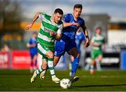 1 April 2024; Aaron Greene of Shamrock Rovers in action against Kacper Radkowski of Waterford during the SSE Airtricity Men's Premier Division match between Waterford and Shamrock Rovers at the Regional Sports Centre in Waterford. Photo by Tyler Miller/Sportsfile