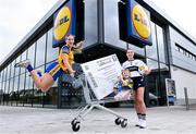 2 April 2024; In attendance at a photocall ahead of the 2024 Lidl Ladies National Football League Finals are Roscommon captain Ellen Irwin and Clare captain Caoimhe Harvey with Kate O'Siochain, age 3. The Divisions 3 and 4 Finals will be played at Grant Heating St Brendan’s Park, Birr, next Saturday, April 6, followed by the Divisions 1 and 2 Finals at Croke Park next Sunday, April 7. Photo by David Fitzgerald/Sportsfile