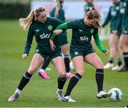 2 April 2024; Kyra Carusa and Megan Connolly, left, during a Republic of Ireland Women's training session at the FAI National Training Centre in Abbotstown, Dublin. Photo by Stephen McCarthy/Sportsfile