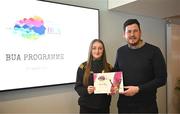 2 April 2024; Hannah Brady of Coatbridge Davitts of North Lanarkshire, Scotland, receives her BUA graduation certificate from LFGA head of volunteer development Niall Mulrine at the 2024 BUA graduation ceremony at Croke Park Stadium, Dublin. The BUA programme is a self-development initiative aimed at supporting young people in the Ladies Gaelic Football Association to develop leadership skills and qualities to benefit their communities. Photo by Harry Murphy/Sportsfile