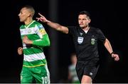 9 March 2024; Referee Rob Hennessy and Graham Burke of Shamrock Rovers during the SSE Airtricity Men's Premier Division match between Sligo Rovers and Shamrock Rovers at The Showgrounds in Sligo. Photo by Stephen McCarthy/Sportsfile