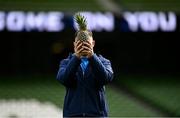5 April 2024; Hugo Keenan with a pineapple during a Leinster rugby captain's run at the Aviva Stadium in Dublin. Photo by Harry Murphy/Sportsfile