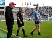 31 March 2024; Brian Fenton of Dublin, making his way off the pitch after he was sent off, alongside sideline official Brendan Healy and Derry manager Mickey Harte during the Allianz Football League Division 1 Final match between Dublin and Derry at Croke Park in Dublin. Photo by Piaras Ó Mídheach/Sportsfile