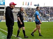 31 March 2024; Brian Fenton of Dublin, making his way off the pitch after he was sent off, alongside sideline official Brendan Healy and Derry manager Mickey Harte during the Allianz Football League Division 1 Final match between Dublin and Derry at Croke Park in Dublin. Photo by Piaras Ó Mídheach/Sportsfile