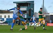 5 April 2024; Success Edogun of Finn Harps shoots under pressure from Luke O'Regan of UCD during the SSE Airtricity Men's First Division match between Finn Harps and UCD at Finn Park in Ballybofey, Donegal. Photo by Ramsey Cardy/Sportsfile