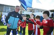 5 April 2024; Finn Harps manager Darren Murphy with the flagbearers before the SSE Airtricity Men's First Division match between Finn Harps and UCD at Finn Park in Ballybofey, Donegal. Photo by Ramsey Cardy/Sportsfile