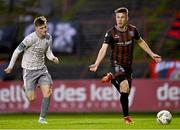 5 April 2024; Dayle Rooney of Bohemians in action against Ben McCormack of Waterford during the SSE Airtricity Men's Premier Division match between Bohemians and Waterford at Dalymount Park in Dublin. Photo by Piaras Ó Mídheach/Sportsfile