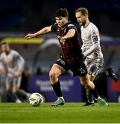 5 April 2024; James Clarke of Bohemians in action against Rowan McDonald of Waterford during the SSE Airtricity Men's Premier Division match between Bohemians and Waterford at Dalymount Park in Dublin. Photo by Piaras Ó Mídheach/Sportsfile
