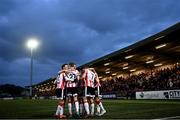 5 April 2024; Adam O'Reilly of Derry City, hidden, celebrates with teammates after scoring their side's first goal during the SSE Airtricity Men's Premier Division match between Derry City and Dundalk at The Ryan McBride Brandywell Stadium in Derry. Photo by Ramsey Cardy/Sportsfile