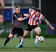 5 April 2024; Cameron McJannet of Derry City in action against Daryl Horgan of Dundalk during the SSE Airtricity Men's Premier Division match between Derry City and Dundalk at The Ryan McBride Brandywell Stadium in Derry. Photo by Ramsey Cardy/Sportsfile