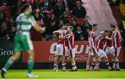 5 April 2024; Joe Redmond of St Patrick's Athletic, left, celebrates with teammates after scoring their side's first goal during the SSE Airtricity Men's Premier Division match between St Patrick's Athletic and Shamrock Rovers at Richmond Park in Dublin. Photo by Seb Daly/Sportsfile