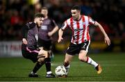 5 April 2024; Michael Duffy of Derry City in action against Scott High of Dundalk during the SSE Airtricity Men's Premier Division match between Derry City and Dundalk at The Ryan McBride Brandywell Stadium in Derry. Photo by Ramsey Cardy/Sportsfile