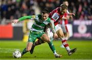 5 April 2024; Darragh Burns of Shamrock Rovers in action against Jamie Lennon of St Patrick's Athletic during the SSE Airtricity Men's Premier Division match between St Patrick's Athletic and Shamrock Rovers at Richmond Park in Dublin. Photo by Seb Daly/Sportsfile