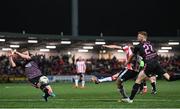 5 April 2024; Michael Duffy of Derry City shoots to score his side's fourth goal despite the attention of Daryl Horgan, left, and Paul Doyle of Dundalk during the SSE Airtricity Men's Premier Division match between Derry City and Dundalk at The Ryan McBride Brandywell Stadium in Derry. Photo by Ramsey Cardy/Sportsfile