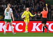 5 April 2024; Republic of Ireland goalkeeper Courtney Brosnan protests to referee Maria Caputi as she is shown a yellow card during the UEFA Women's European Championship qualifying group A match between France and Republic of Ireland at Stade Saint-Symphorien in Metz, France. Photo by Stephen McCarthy/Sportsfile