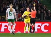 5 April 2024; Republic of Ireland goalkeeper Courtney Brosnan protests to referee Maria Caputi as she is shown a yellow card during the UEFA Women's European Championship qualifying group A match between France and Republic of Ireland at Stade Saint-Symphorien in Metz, France. Photo by Stephen McCarthy/Sportsfile
