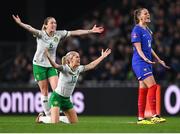 5 April 2024; Denise O'Sullivan, 10, and Megan Connolly of Republic of Ireland protest to referee Maria Caputi, not pictured, during the UEFA Women's European Championship qualifying group A match between France and Republic of Ireland at Stade Saint-Symphorien in Metz, France. Photo by Stephen McCarthy/Sportsfile