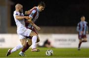 5 April 2024; Killian Cailloce of Drogheda United is tackled by Mark Coyle of Shelbourne during the SSE Airtricity Men's Premier Division match between Drogheda United and Shelbourne at Weavers Park in Drogheda, Louth. Photo by Shauna Clinton/Sportsfile