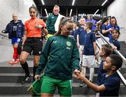 5 April 2024; Republic of Ireland captain Katie McCabe meets her player escort before the UEFA Women's European Championship qualifying group A match between France and Republic of Ireland at Stade Saint-Symphorien in Metz, France. Photo by Stephen McCarthy/Sportsfile
