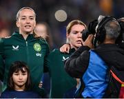 5 April 2024; Republic of Ireland players Anna Patten, left, and Aoife Mannion stand for the playing of the National Anthem before the UEFA Women's European Championship qualifying group A match between France and Republic of Ireland at Stade Saint-Symphorien in Metz, France. Photo by Stephen McCarthy/Sportsfile