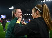 5 April 2024; Republic of Ireland goalkeeper Courtney Brosnan has her anthem jacket removed by team-mate Grace Moloney before the UEFA Women's European Championship qualifying group A match between France and Republic of Ireland at Stade Saint-Symphorien in Metz, France. Photo by Stephen McCarthy/Sportsfile