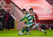 5 April 2024; Darragh Burns of Shamrock Rovers in action against Anto Breslin of St Patrick's Athletic during the SSE Airtricity Men's Premier Division match between St Patrick's Athletic and Shamrock Rovers at Richmond Park in Dublin. Photo by Seb Daly/Sportsfile