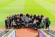6 April 2024; Members of the GAA Wheelchair Development Group pose for a group photo during the GAA Wheelchair Sports Development Day at Croke Park in Dublin. Photo by Matt Browne/Sportsfile