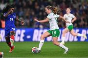 5 April 2024; Kyra Carusa of Republic of Ireland in action against Griedge Mbock Bathy of France during the UEFA Women's European Championship qualifying group A match between France and Republic of Ireland at Stade Saint-Symphorien in Metz, France. Photo by Stephen McCarthy/Sportsfile