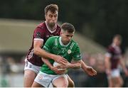 6 April 2024; Fiontan Eastwood of London is tackled by Paul Conroy of Galway during the Connacht GAA Football Senior Championship quarter-final match between London and Galway at McGovern Park in Ruislip, England. Photo by Brendan Moran/Sportsfile