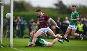 6 April 2024; Cathal Sweeney of Galway scores his side's first goal despite the efforts of Stephen Dornan of London during the Connacht GAA Football Senior Championship quarter-final match between London and Galway at McGovern Park in Ruislip, England. Photo by Brendan Moran/Sportsfile
