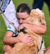 6 April 2024; Ellie Woulfe of Limerick is consoled by her dog Lexi after her side's defeat in the Lidl LGFA National League Division 4 final match between Carlow and Limerick at St Brendan’s Park in Birr, Offaly. Photo by Ben McShane/Sportsfile