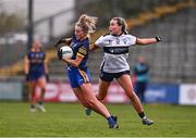 6 April 2024; Laura Fleming of Roscommon is tackled by Amy Sexton of Clare during the Lidl LGFA National League Division 3 final match between Clare and Roscommon at St Brendan’s Park in Birr, Offaly. Photo by Ben McShane/Sportsfile