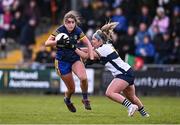 6 April 2024; Caoimhe Cregg of Roscommon in action against Laurie Ryan of Clare during the Lidl LGFA National League Division 3 final match between Clare and Roscommon at St Brendan’s Park in Birr, Offaly. Photo by Ben McShane/Sportsfile