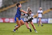 6 April 2024; Fidelma Marrinan of Clare in action against Saoirse Wynne of Roscommon during the Lidl LGFA National League Division 3 final match between Clare and Roscommon at St Brendan’s Park in Birr, Offaly. Photo by Ben McShane/Sportsfile