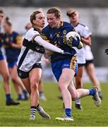 6 April 2024; Lisa O'Rourke of Roscommon is tackled by Teresa Collins of Clare during the Lidl LGFA National League Division 3 final match between Clare and Roscommon at St Brendan’s Park in Birr, Offaly. Photo by Ben McShane/Sportsfile